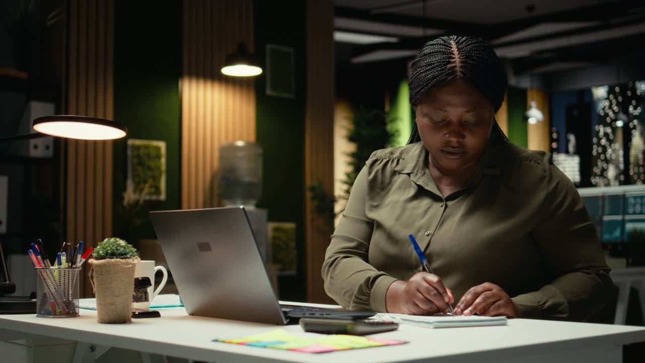 Businesswoman hosting international video call with executive board members