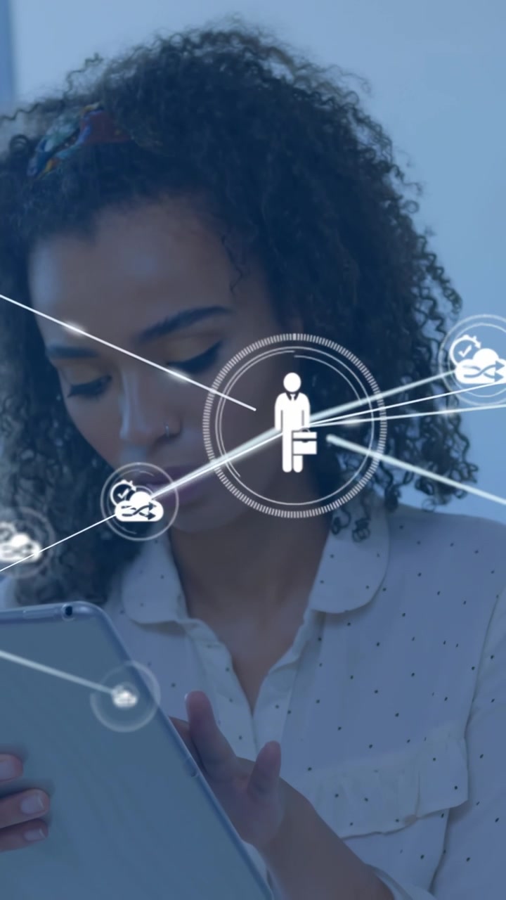 Vertical video: Woman tapping tablet causing network nodes layering over torso for network review