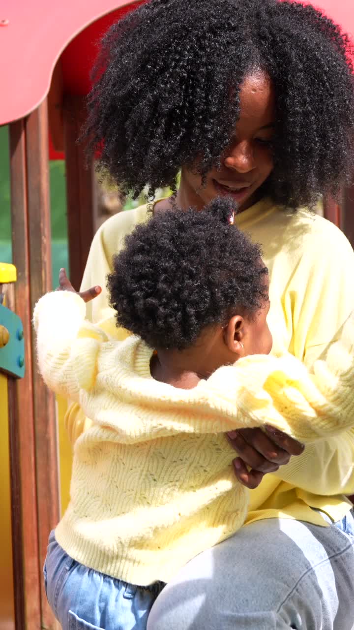 Mother and Child Playing on a Playground