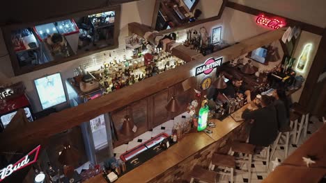 a lively rooftop bar interior with people