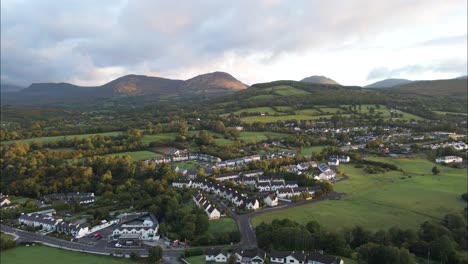 village town of kenmare, ireland by ring of kerry - aerial at sunset