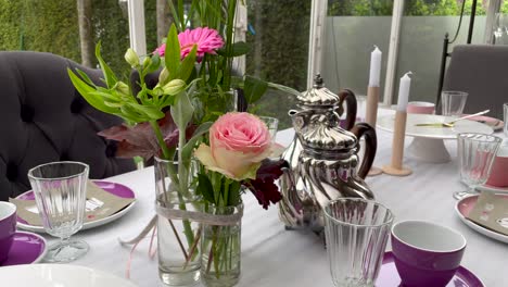 dolly zoom in shot of beautiful served table setting laid during wedding party