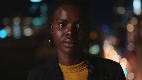 portrait beautiful african american woman on rooftop at night wearing stylish fashion enjoying urban city nightlife