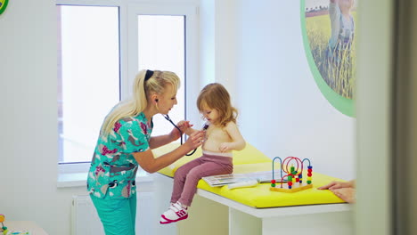 pediatrician holding stethoscope. pediatrician check heart lungs of kid