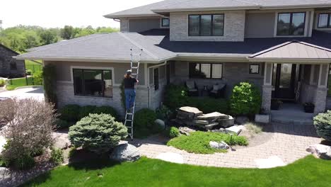 Drone-push-in-on-a-home-improvement-crew-getting-out-of-a-truck-with-tools