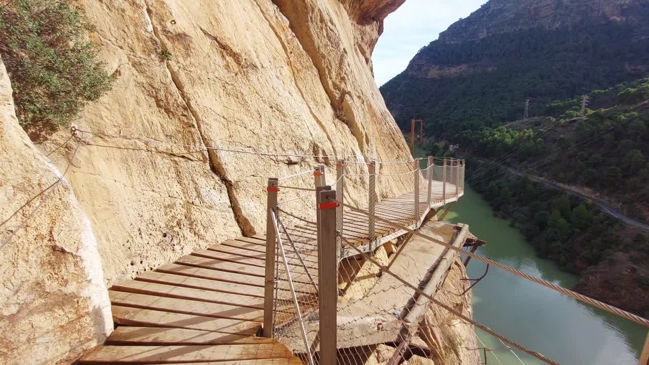 Person walking along the Caminito del Rey walkway