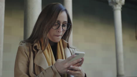 student reading good news on phone