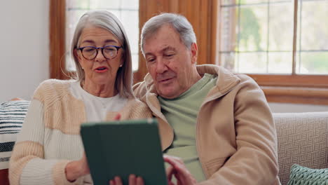tablet, conversation and senior couple on sofa