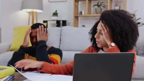 Stress,-finance-and-laptop-with-couple-in-living