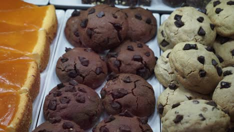 chocolate chip cookies in a bakery display