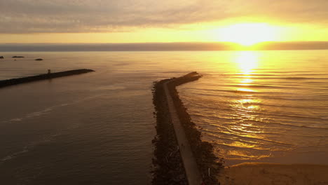 aerial view of north jetty in bullards beach, bandon oregon at sunset - aerial descend