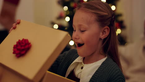 excited girl opening christmas gift
