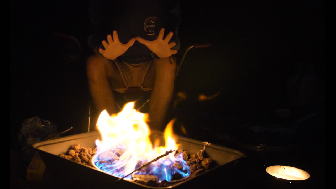 warming hands by the fire pit