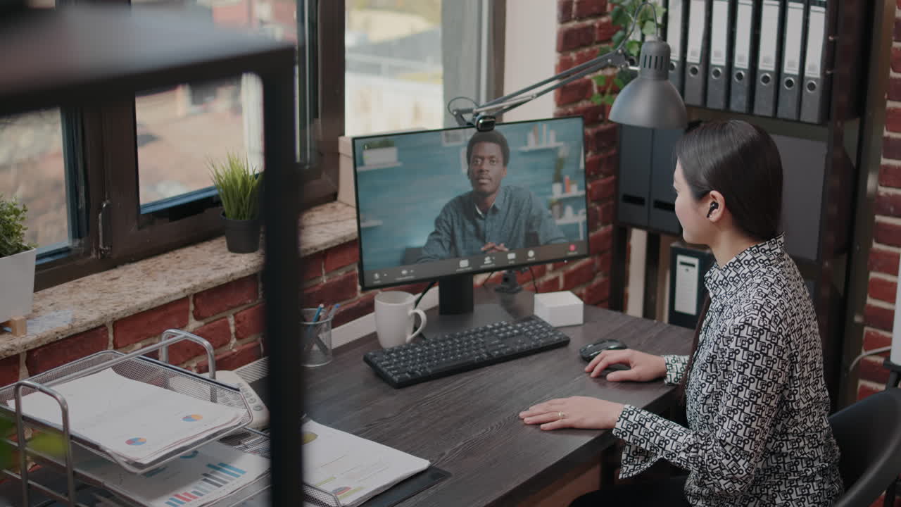 Employee talking to man on video call communication