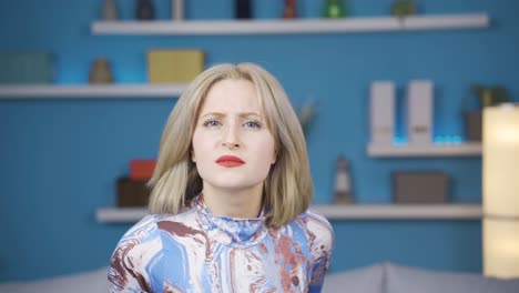 Angry-and-frustrated-young-woman-looking-at-camera.