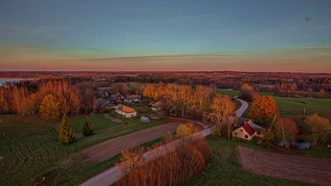 beautiful overview of a small village beside a lake during evening time in timelapse