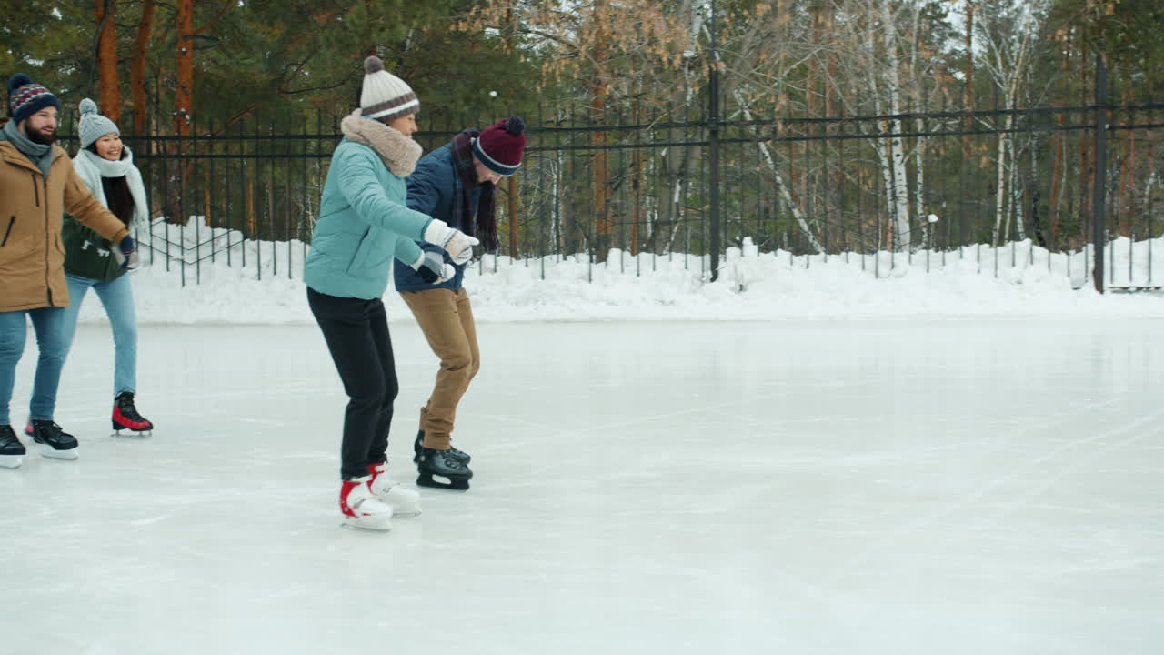 Friends Ice Skating in Winter Park