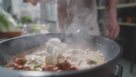 cooking creamy dish in a pan