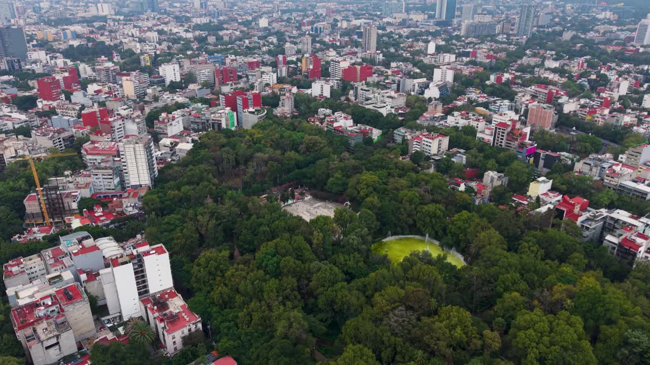 Drone footage over Condesa, Mexico City featuring green zones and premium real estate sectors