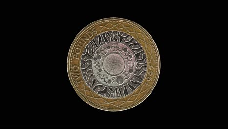 united kingdom 2 pound 1997 reverse with four concentric circles, macro loop on black background