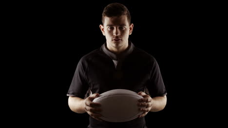 Serious-rugby-player-with-ball