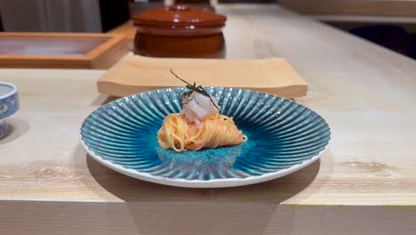 noodles elegantly plated with seafood garnish