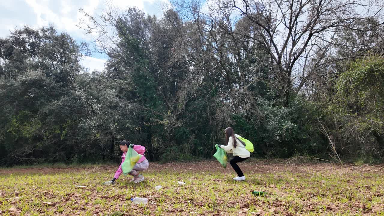 Teenagers cleaning up the forest