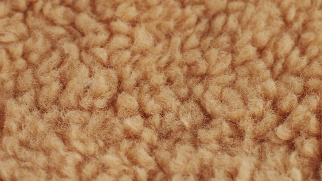 Footer textile cloth texture close-up macro. Fashion fabric multicolor. Sheep wool for clothes . High quality 4k footage