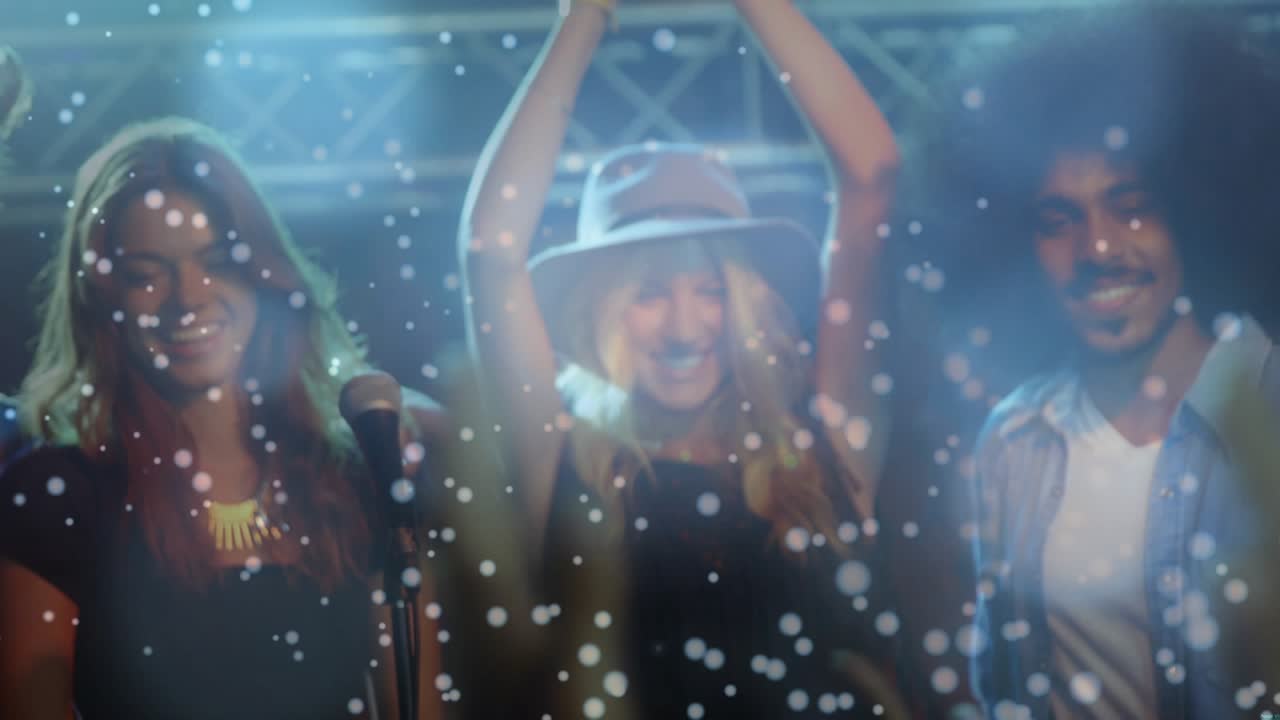 Band raising trophy and starting falling snow celebrating music award, singer sharing mic smiling