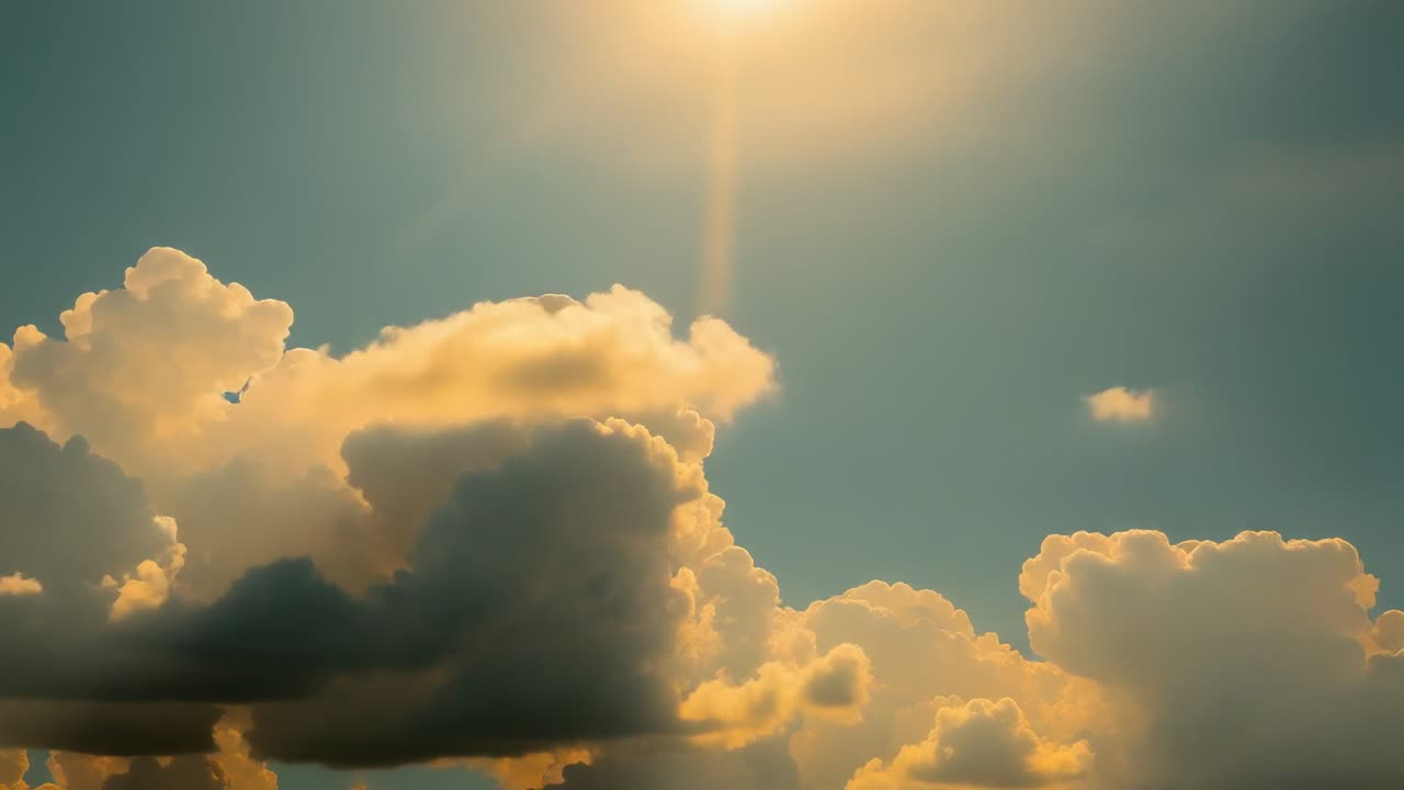 Emerging sun casting golden hues across cumulus clouds over horizon, capturing sunset transition