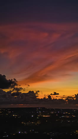 sunset sky behind cloudscape in bali town, indonesia. timelapse