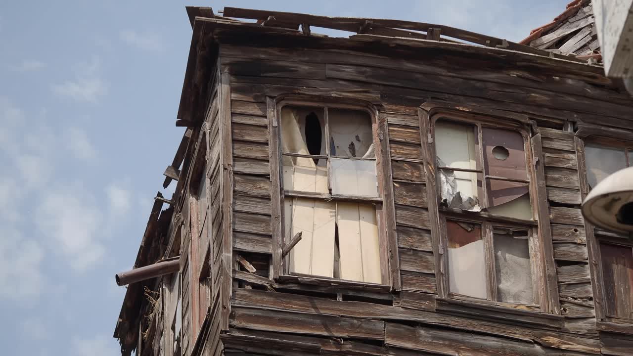 Close-up of a Dilapidated Wooden Building with Broken Windows