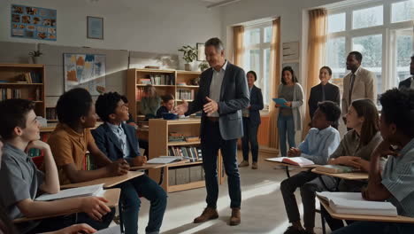 teacher leading a discussion with students in a classroom
