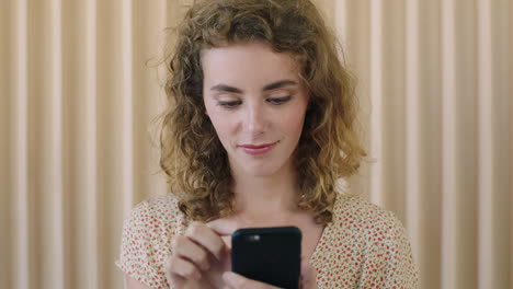 close-up-portrait-of-beautiful-young-red-head-woman-enjoying-texting-browsing-using-smartphone-mobile-technology