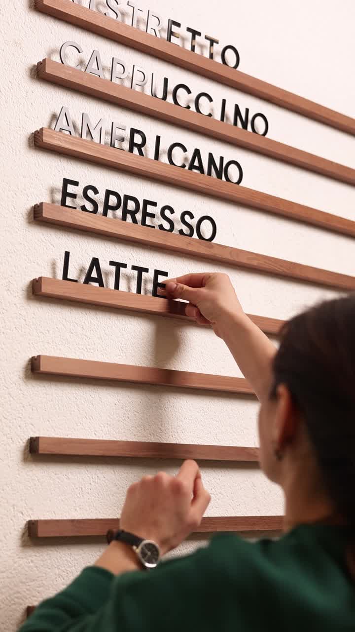 Person Installing Coffee Menu Board