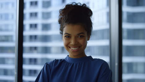 Businesswoman-posing-in-office