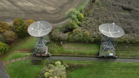 aerial trucking shot of the antenna array at the mullard radio astronomy observatory - a one-mile radio telescope