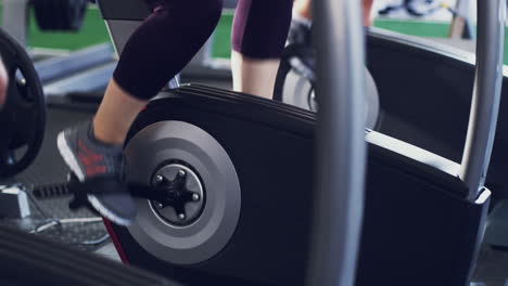 Cycling,-fitness-and-shoes-of-people-in-gym