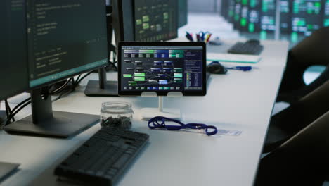 modern tech office workspace with multiple screens and tablet