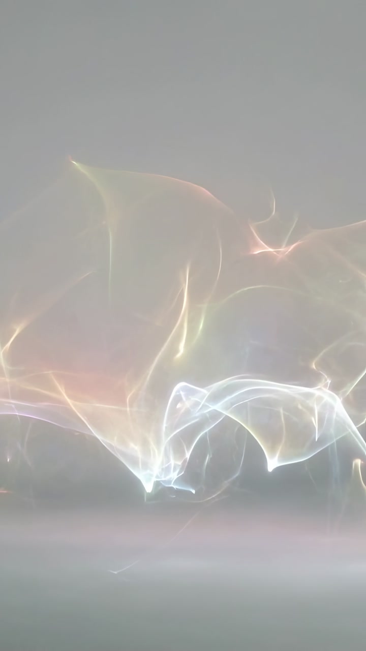 Vertical video: Drifting colorful sheer ribbons forming bright knot at lower center on gray plane