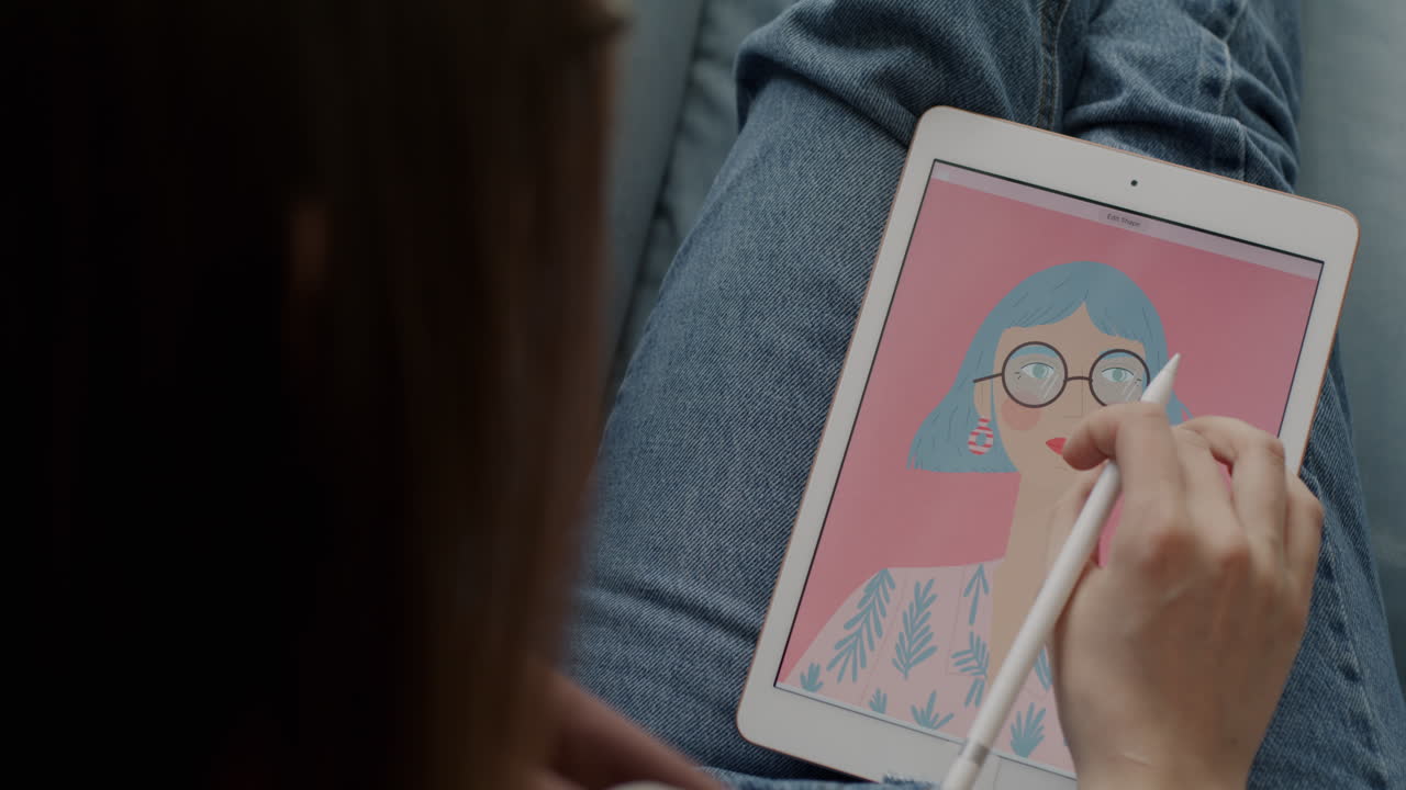 Woman drawing a digital portrait on an iPad