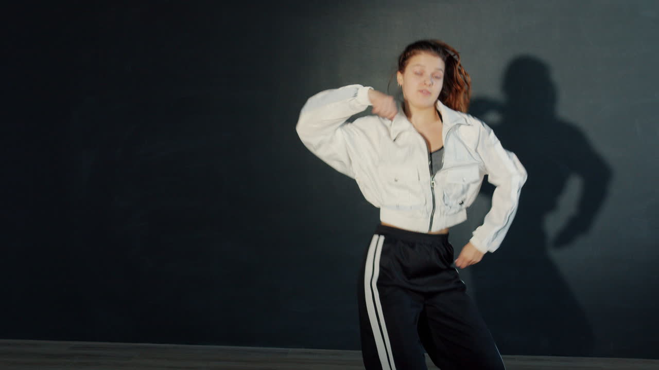 Young Woman Performing a Dynamic Street Dance