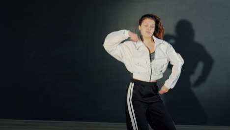 young woman performing a dynamic street dance