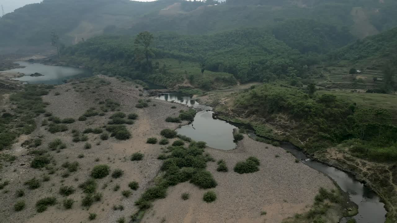 Aerial View of a Dammed River and Surrounding Landscape