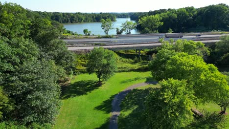 Highway-and-freeway-cutting-through-nature-forest-and-fields-in-America