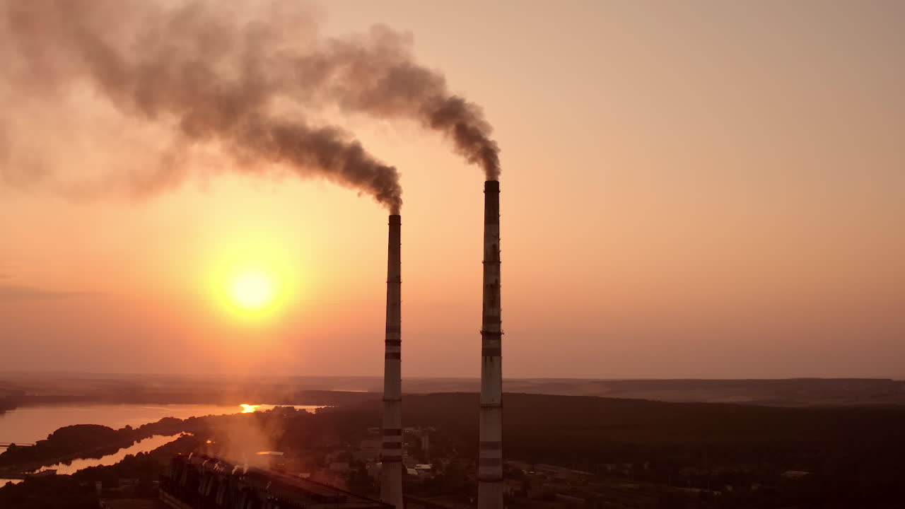 Static view of the power pylons on sunset time background. High voltage electric tower at the sunset. Fabric concept. Selective focus