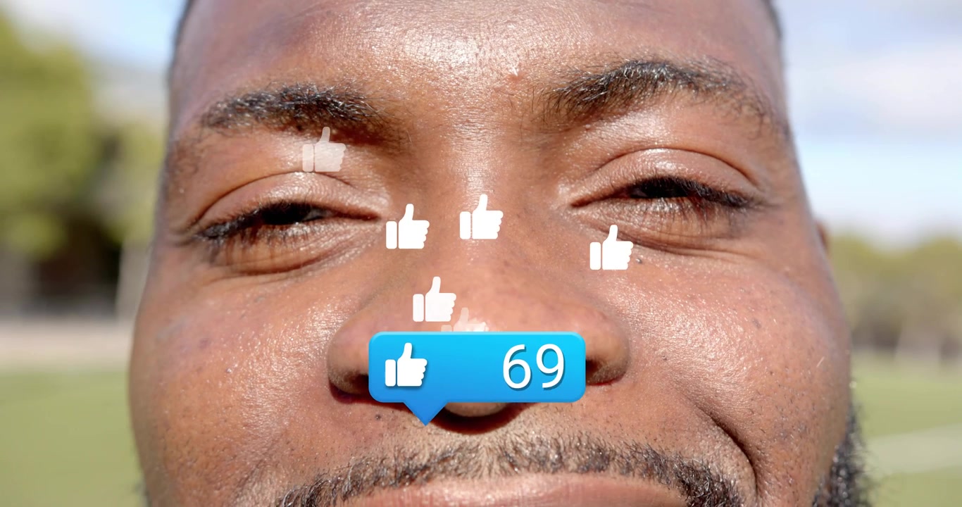 Mand ser en social medie-boble dukke op, der viser et stigende antal likes, hvilket illustrerer engagement.
