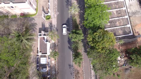 Following-a-car-exiting-IT-park-in-aerial-view