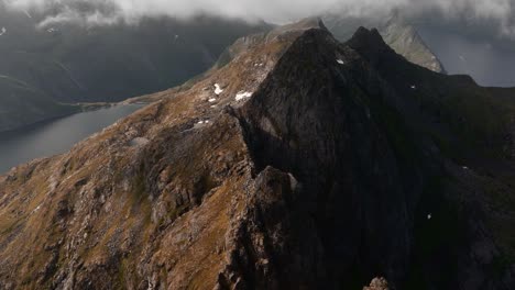 Aerial-view-of-Segla-mountain-above-the-sky,-Norway-during-summer