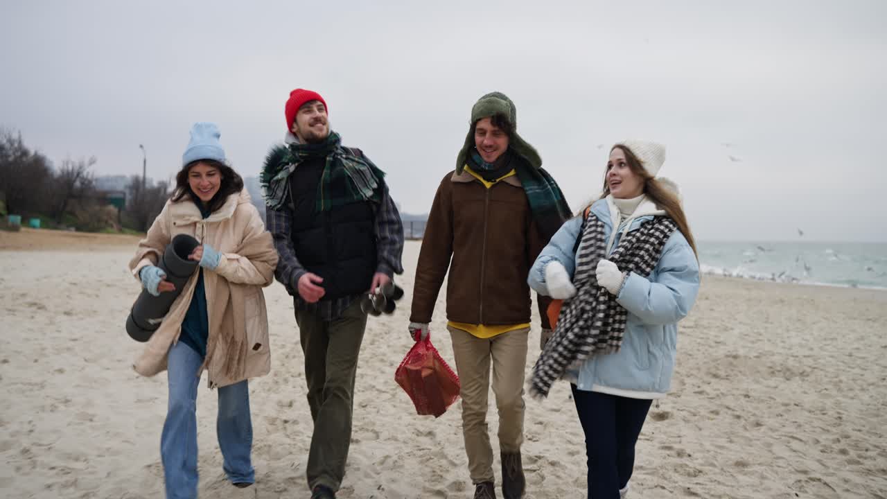 Friends Walking on the Beach in Winter